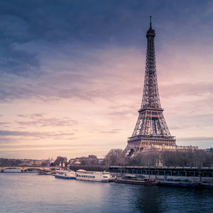 Best France eSIM plan for tourists — woman using smartphone while sightseeing in Paris.